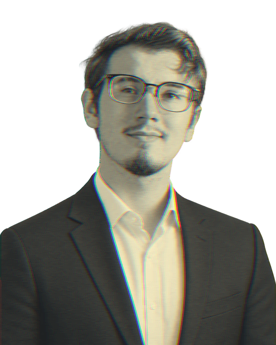 Cole Wisniewski wearing glasses and a dark suit jacket